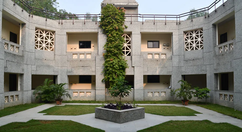 Modern IIM Lucknow campus hostel block with courtyard view
